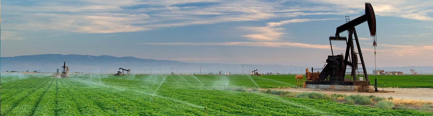farm field and pumpjack in north san joaquin valley, ca