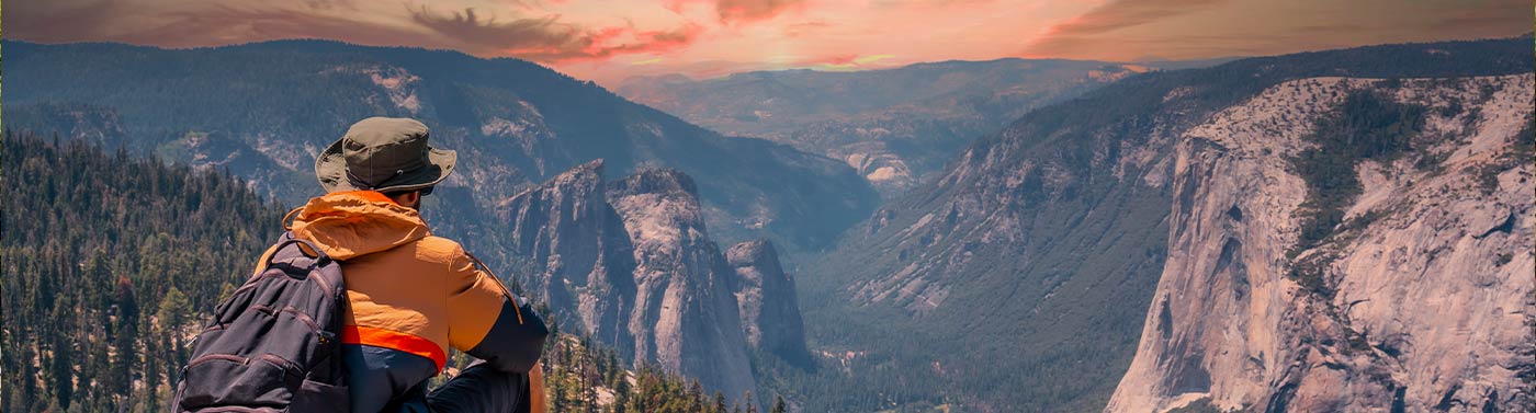 hiker at overlook at yosemite national park in California