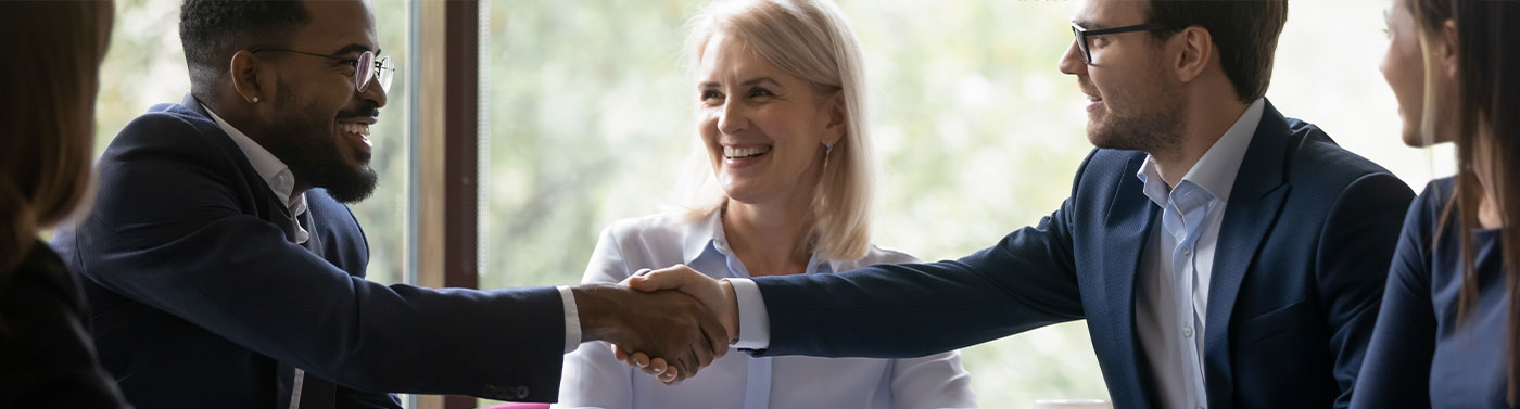 diverse group of people meeting and shaking hands