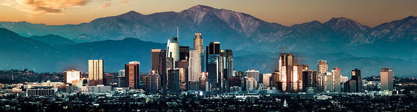 downtown los angeles at sunset with mountains